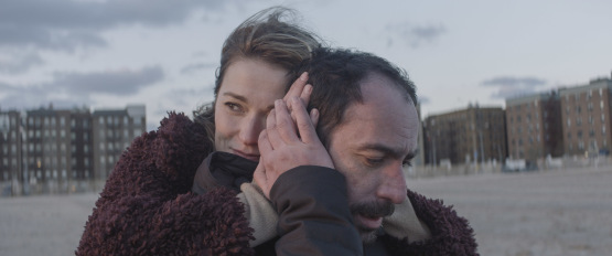 Nadezhda Mikhalkova (Lena) and Giorgi Tabidze (Soso) on the beach in Brighton Beach, Brooklyn, in Brighton 4th, directed by Levan Koguashvili. Image courtesy of Lorber.