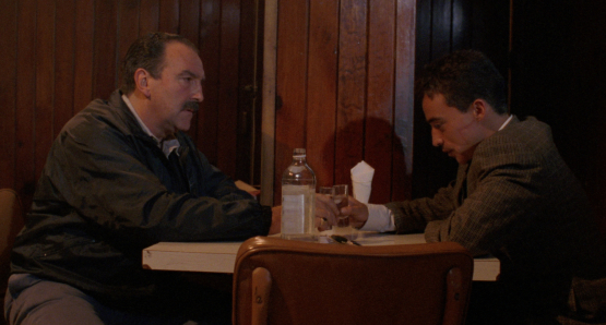 Pedro Armendáriz Jr. as Sargento Barreras and Roberto Sosa as Pedro in Alex Cox's HIGHWAY PATROLMAN.