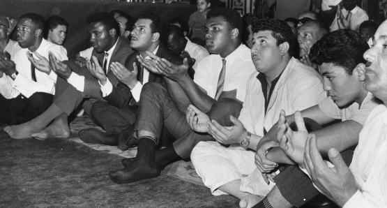 Ali prays at the Hussein Mosque in Cairo in June 1964, four months after changing his name from Cassius Clay and announcing he is a member of the Nation of Islam.