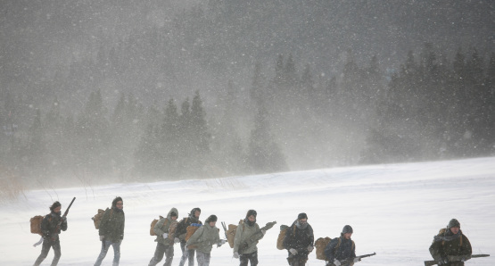 The RLF makes the trek across the mountain through the snow