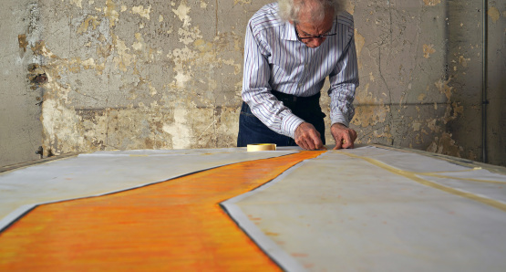 Christo in a scene from <i>Walking on Water</i>, courtesy Kino Lorber